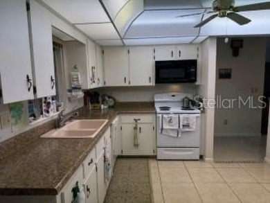 Wonderful Montgomery unit with combo living room, dining room on On Top of the World Golf Course in Florida - for sale on GolfHomes.com, golf home, golf lot