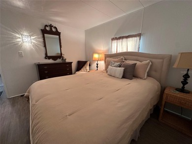 Welcome to Holiday Park! This turn-key furnished LAND-OWNED on Sabal Trace Golf and Country Club in Florida - for sale on GolfHomes.com, golf home, golf lot