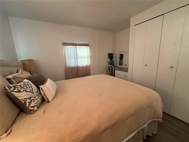 Welcome to Holiday Park! This turn-key furnished LAND-OWNED on Sabal Trace Golf and Country Club in Florida - for sale on GolfHomes.com, golf home, golf lot