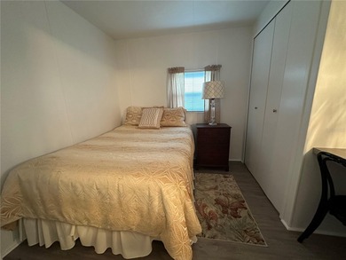 Welcome to Holiday Park! This turn-key furnished LAND-OWNED on Sabal Trace Golf and Country Club in Florida - for sale on GolfHomes.com, golf home, golf lot