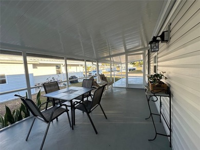 Welcome to Holiday Park! This turn-key furnished LAND-OWNED on Sabal Trace Golf and Country Club in Florida - for sale on GolfHomes.com, golf home, golf lot