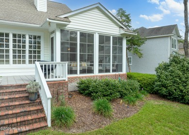 Overlooking the lush 10th fairway, this beautifully maintained on Porters Neck Country Club in North Carolina - for sale on GolfHomes.com, golf home, golf lot