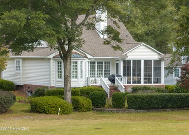 Overlooking the lush 10th fairway, this beautifully maintained on Porters Neck Country Club in North Carolina - for sale on GolfHomes.com, golf home, golf lot