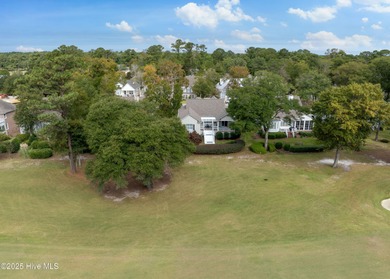 Overlooking the lush 10th fairway, this beautifully maintained on Porters Neck Country Club in North Carolina - for sale on GolfHomes.com, golf home, golf lot