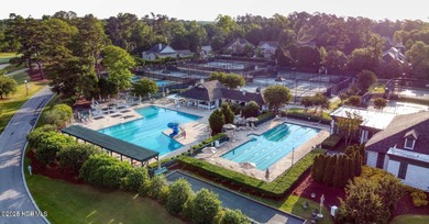 Overlooking the lush 10th fairway, this beautifully maintained on Porters Neck Country Club in North Carolina - for sale on GolfHomes.com, golf home, golf lot