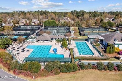 Overlooking the lush 10th fairway, this beautifully maintained on Porters Neck Country Club in North Carolina - for sale on GolfHomes.com, golf home, golf lot