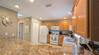 This charming 2-bedroom, 2-bathroom courtyard villa offers 1,132 on The Links of Spruce Creek in Florida - for sale on GolfHomes.com, golf home, golf lot