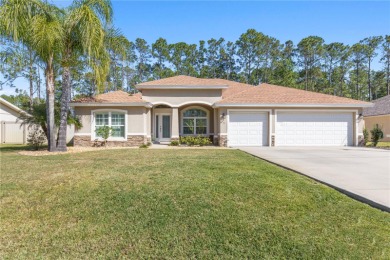 Welcome to your dream home in Palm Coast! Nestled in a serene on The Grand Club Cypress Course in Florida - for sale on GolfHomes.com, golf home, golf lot