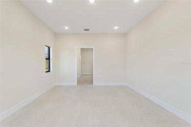 STUNNING NEW CONSTRUCTION HOME in Indian Lake Estates - Golf on Indian Lake Estates Golf and Country Club in Florida - for sale on GolfHomes.com, golf home, golf lot