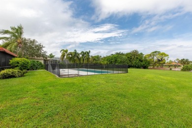 This gorgeous pool home is situated on a larger, 1.13-acre on The Wanderers Club in Florida - for sale on GolfHomes.com, golf home, golf lot