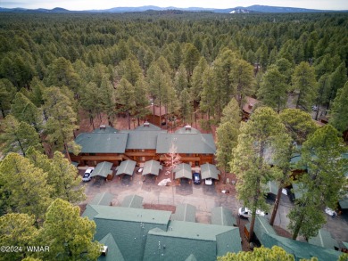 Welcome to 2531 Village Court, a charming end unit nestled on on Pinetop Lakes Golf and Country Club in Arizona - for sale on GolfHomes.com, golf home, golf lot