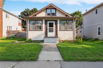 This 3-bedroom, 2-bath home features beautiful natural woodwork on Phalen Park Golf Course in Minnesota - for sale on GolfHomes.com, golf home, golf lot