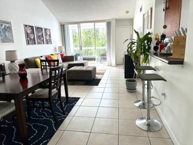 SPACIOUS BRIGHT 2 BEDROOM 2 BATHROOM AT THE GREENS AT DORAL on Jim McLean Signature Course in Florida - for sale on GolfHomes.com, golf home, golf lot