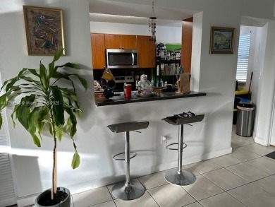 SPACIOUS BRIGHT 2 BEDROOM 2 BATHROOM AT THE GREENS AT DORAL on Jim McLean Signature Course in Florida - for sale on GolfHomes.com, golf home, golf lot