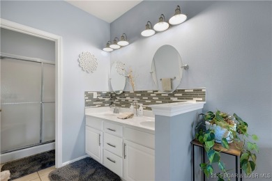Experience lake life at its finest in this stunning 4-bedroom on The Club At Old Kinderhook in Missouri - for sale on GolfHomes.com, golf home, golf lot
