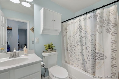 Experience lake life at its finest in this stunning 4-bedroom on The Club At Old Kinderhook in Missouri - for sale on GolfHomes.com, golf home, golf lot