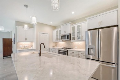 This beautifully decorated Boca Royale Sandcastle model features on Boca Royale Golf and Country Club in Florida - for sale on GolfHomes.com, golf home, golf lot