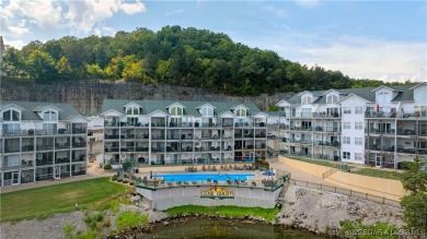 Experience lake life at its finest in this stunning 4-bedroom on The Club At Old Kinderhook in Missouri - for sale on GolfHomes.com, golf home, golf lot