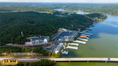 Experience lake life at its finest in this stunning 4-bedroom on The Club At Old Kinderhook in Missouri - for sale on GolfHomes.com, golf home, golf lot