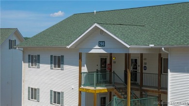 Experience lake life at its finest in this stunning 4-bedroom on The Club At Old Kinderhook in Missouri - for sale on GolfHomes.com, golf home, golf lot