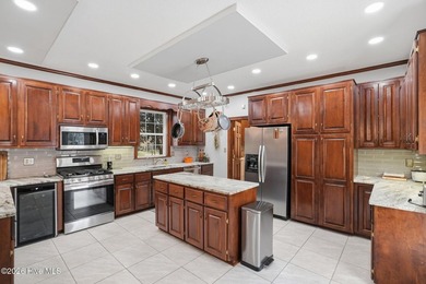 Custom-built 3BR/3.5BA brick Cape Cod situated on the 3rd on Sound Golf Links at Albemarle Plantation in North Carolina - for sale on GolfHomes.com, golf home, golf lot