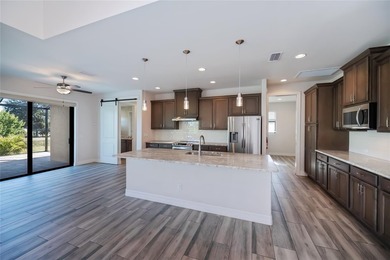 Exquisite 2021 custom-built DM Dean residence on a fully fenced on Rotonda Golf and Country Club The Palms Course in Florida - for sale on GolfHomes.com, golf home, golf lot