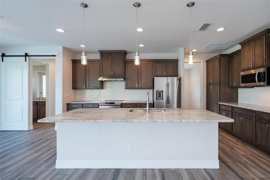 Exquisite 2021 custom-built DM Dean residence on a fully fenced on Rotonda Golf and Country Club The Palms Course in Florida - for sale on GolfHomes.com, golf home, golf lot