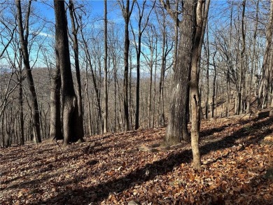 This 1.34 acre wooded lot is located close to the front gate of on Bent Tree Golf Course in Georgia - for sale on GolfHomes.com, golf home, golf lot