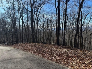 This 1.34 acre wooded lot is located close to the front gate of on Bent Tree Golf Course in Georgia - for sale on GolfHomes.com, golf home, golf lot
