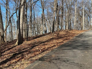 This 1.34 acre wooded lot is located close to the front gate of on Bent Tree Golf Course in Georgia - for sale on GolfHomes.com, golf home, golf lot