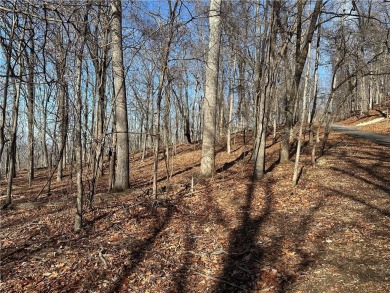 This 1.34 acre wooded lot is located close to the front gate of on Bent Tree Golf Course in Georgia - for sale on GolfHomes.com, golf home, golf lot