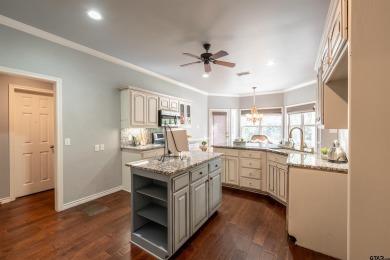 Experience resort-style living in this beautiful 4-bedroom on Hide-A-Way Lake Golf Course in Texas - for sale on GolfHomes.com, golf home, golf lot