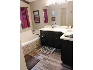 Custom built 3-bedroom, 2-bathroom masonry-built home nestled on on Glen Abbey Golf Club in Florida - for sale on GolfHomes.com, golf home, golf lot