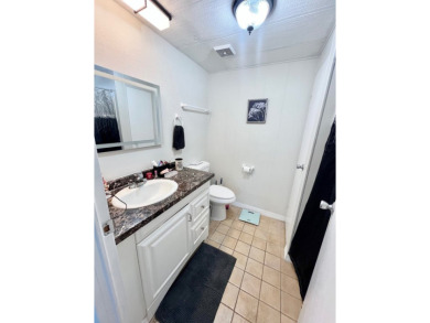 This beautiful two-bedroom, two-bath home is located in the on Pine Lakes Country Club in Florida - for sale on GolfHomes.com, golf home, golf lot