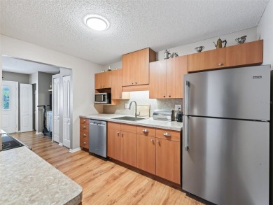 This spacious 2-bedroom, 2 1/2 -bathroom townhome is nestled in on On Top of the World Golf Course in Florida - for sale on GolfHomes.com, golf home, golf lot