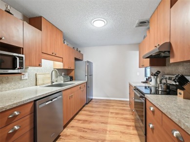 This spacious 2-bedroom, 2 1/2 -bathroom townhome is nestled in on On Top of the World Golf Course in Florida - for sale on GolfHomes.com, golf home, golf lot