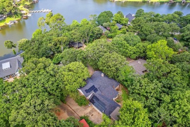 Experience resort-style living in this beautiful 4-bedroom on Hide-A-Way Lake Golf Course in Texas - for sale on GolfHomes.com, golf home, golf lot