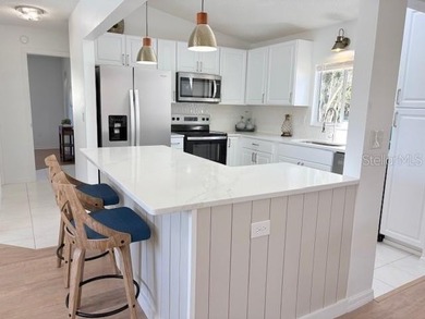 This beautifully FURNISHED and REMODELED home sitting on a on The Links of Spruce Creek in Florida - for sale on GolfHomes.com, golf home, golf lot