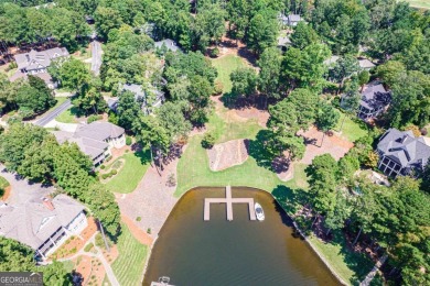Experience refined lake access living at 1011 Plantation Point on Reynolds Lake Oconee - The Oconee in Georgia - for sale on GolfHomes.com, golf home, golf lot