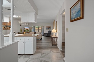 Come home to relaxed Florida living in a beautifully cared-for on Beacon Woods Golf Club in Florida - for sale on GolfHomes.com, golf home, golf lot