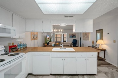 Come home to relaxed Florida living in a beautifully cared-for on Beacon Woods Golf Club in Florida - for sale on GolfHomes.com, golf home, golf lot