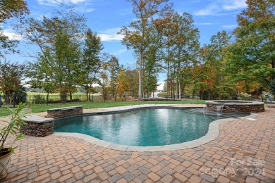 Experience waterfront luxury  long-range golf views from this on Trump National Golf Club Charlotte in North Carolina - for sale on GolfHomes.com, golf home, golf lot