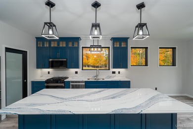 Experience refined modern living in this stunning 2025 on Indian Lake Golf and Country Club in Michigan - for sale on GolfHomes.com, golf home, golf lot