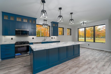 Experience refined modern living in this stunning 2025 on Indian Lake Golf and Country Club in Michigan - for sale on GolfHomes.com, golf home, golf lot