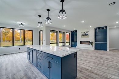 Experience refined modern living in this stunning 2025 on Indian Lake Golf and Country Club in Michigan - for sale on GolfHomes.com, golf home, golf lot