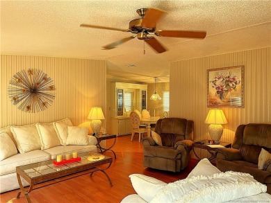 Delightful furnished home featuring wood laminate flooring on Indianwood Golf and Country Club in Florida - for sale on GolfHomes.com, golf home, golf lot