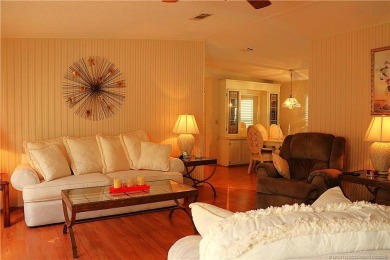Delightful furnished home featuring wood laminate flooring on Indianwood Golf and Country Club in Florida - for sale on GolfHomes.com, golf home, golf lot