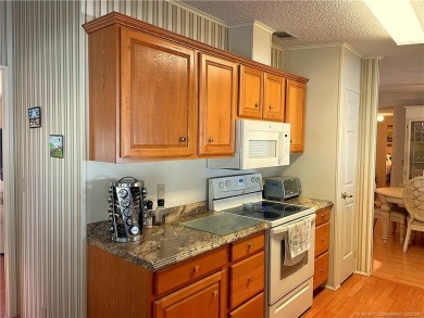 Delightful furnished home featuring wood laminate flooring on Indianwood Golf and Country Club in Florida - for sale on GolfHomes.com, golf home, golf lot
