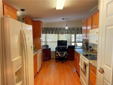 Delightful furnished home featuring wood laminate flooring on Indianwood Golf and Country Club in Florida - for sale on GolfHomes.com, golf home, golf lot