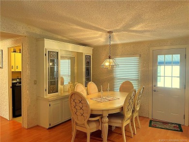 Delightful furnished home featuring wood laminate flooring on Indianwood Golf and Country Club in Florida - for sale on GolfHomes.com, golf home, golf lot